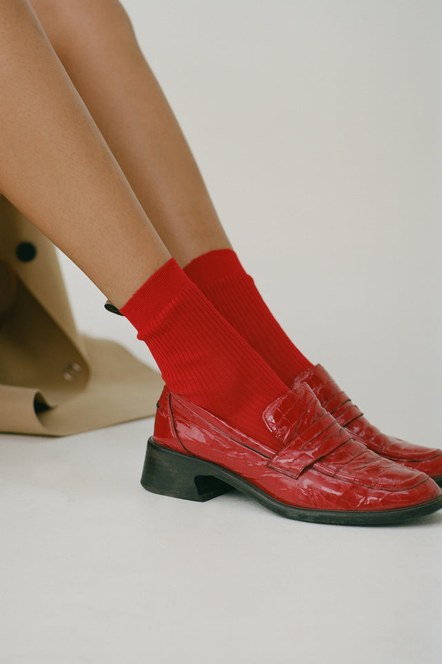 The Agnelli Sock in Chili, Egyptian Cotton, on model with matching red loafers